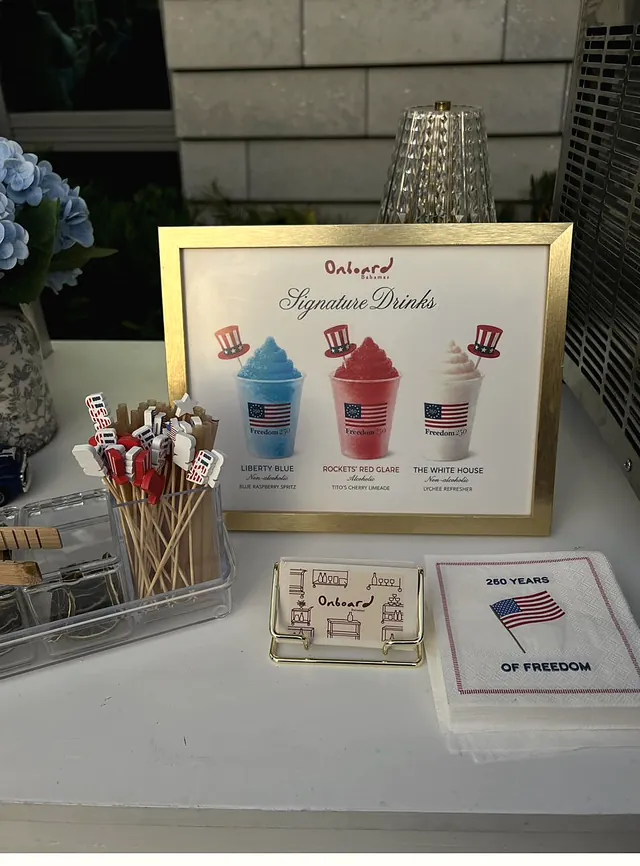 The Freedom 250 drinks table with its framed menu, flag stirrers and printed napkins